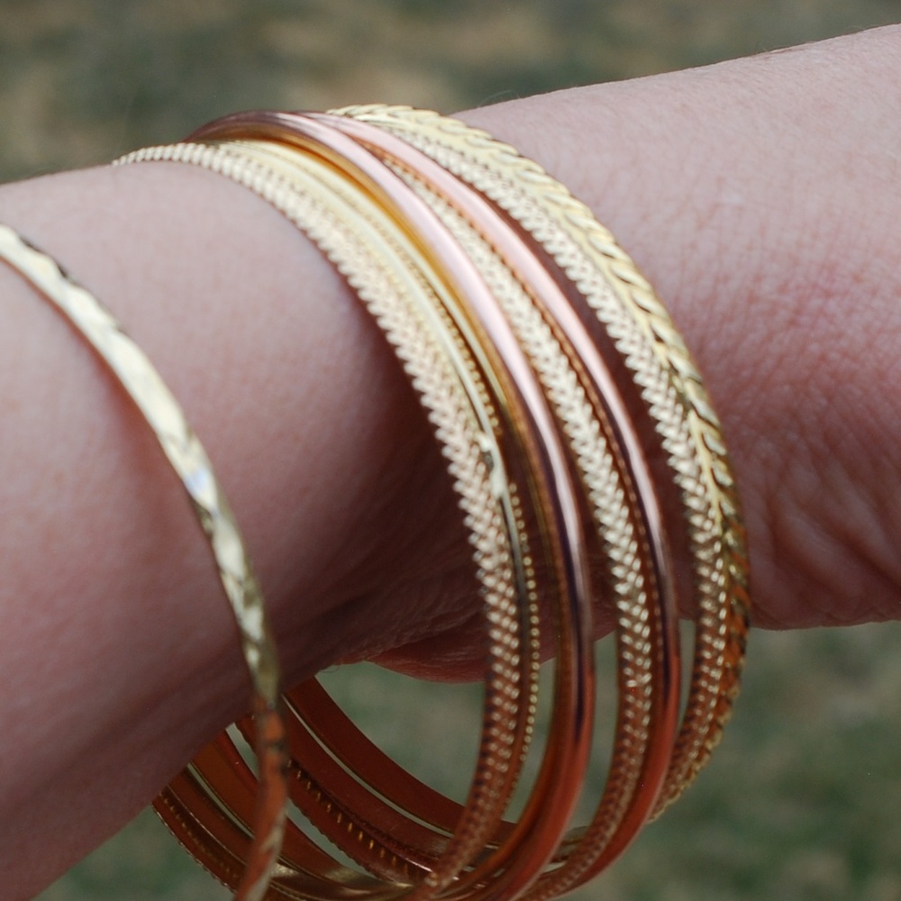 Nine Gold Tone Bangle Bracets